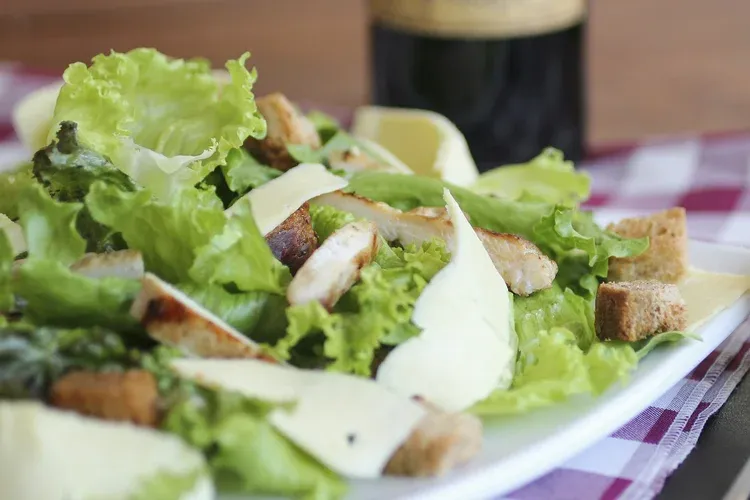 Fresh Caesar salad with croutons and parmesan cheese