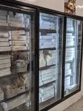 Malley's Seafood upright retail display freezers stocked with products